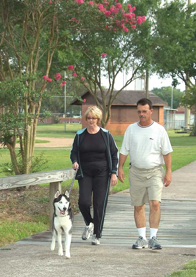 Jodi and her husband walking their dog